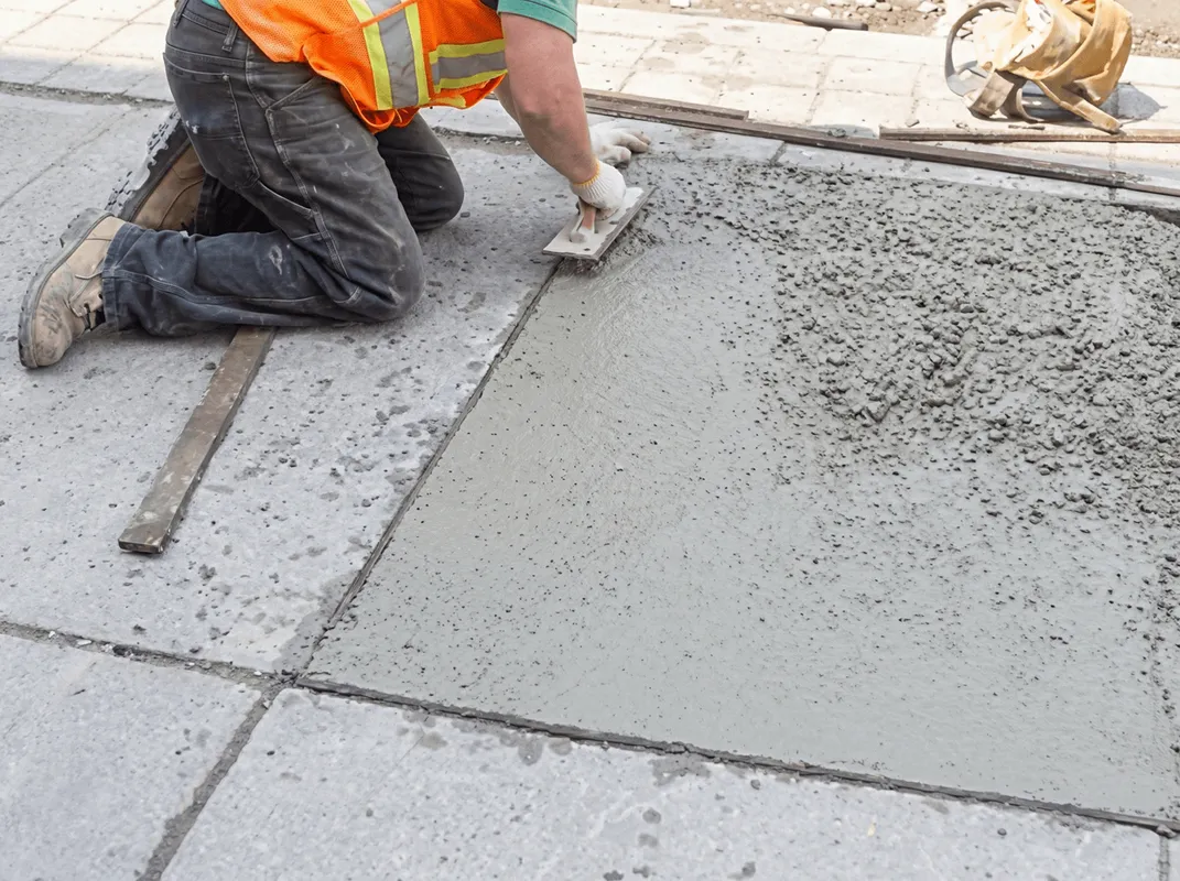 Professional repairing a concrete floor in Chicago, IL