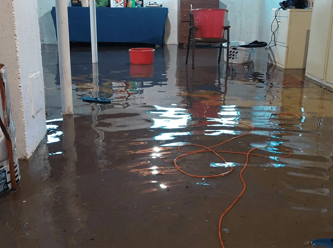 Basement with boiler, cabinets and washing machine completely flooded in Chicago, IL